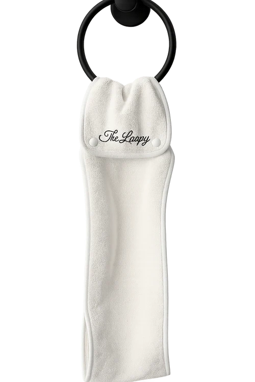 A Coconut Essentials Loopy towel hanging from a ring.